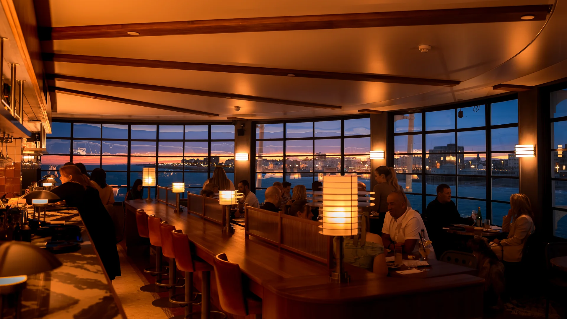 The dining room at twilight, candles lit